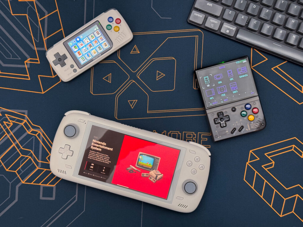 Photo of a Pocket Go, Miyoo Mini Plus, and Ayn Odin 2 emulator on a gaming mousepad